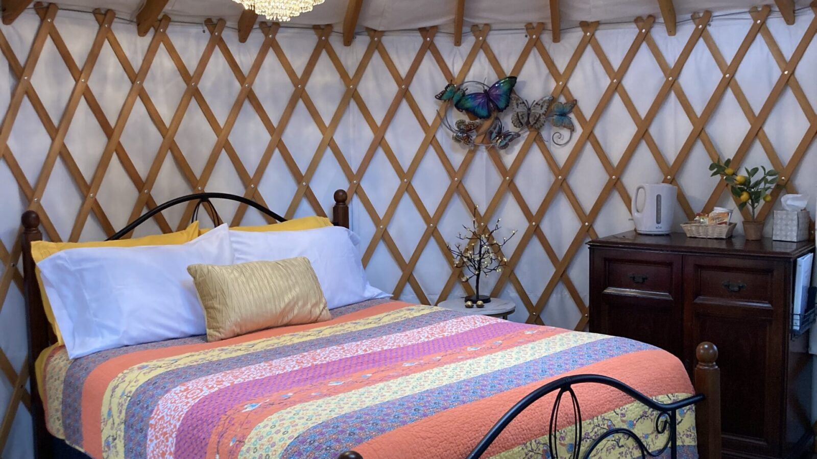 Cozy queen bed with heated matress pad inside the yurt